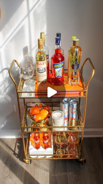 The Spritz Effect | Sarah Louise on Instagram: "It’s coming…. 🍊🥂🫶🏼   Spritz season is almost upon us — and I could NOT be more excited 🥹 the weather feels like I should have a spritz in one hand & a one way plane ticket to Italy in the other!   Bar cart is from World Market, let me know if you have any other questions about where things are from and I will let you know! 😙  #thespritzeffect #spritzseason #aperol #aperolspritz #aperoltime #spritztime #charleston #spritzgirlsummer" Sunset Spritz Party, Make Your Own Aperol Spritz Bar, Aperol Spritz Dinner Party, Aperol Spritz Tower Wedding, Spritz Station, Plane Ticket To Italy, Aperol Spritz Tower, Ticket To Italy, Aperol Spritz Bar