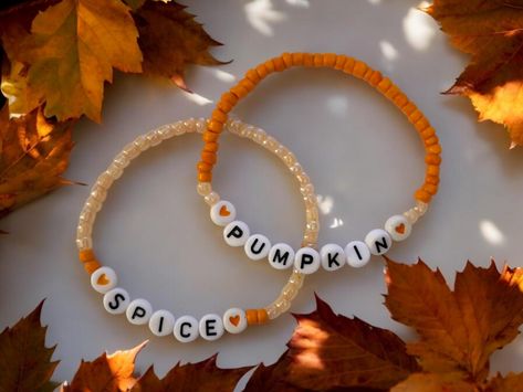 🎃PUMPKIN SPICE handcrafted beaded bracelets.  Fall is on the way and that means  ...yep...pumpkin spice  This is for a set of 2 stretch bracelets made with glass beads and acrylic letter/heart beads.  Wear them alone or stack them with other bracelets.  A perfect addition to a Fall wardrobe. Great gift idea!  If you are buying it as a gift the standard size is 7".  How to measure for a bracelet... Wrap a measuring tape around your wrist at the point where you want to wear the bracelet. If you don't have a flexable measuring tape, use a piece of string, or strip of paper, mark the length, and measure it with a ruler.  Now make sure you add 1/2" to your measurement. Women's Extra Small: 6.5 inches Women's Small: 6.75 inches Women's Standard: 7 Inches Women's Medium: 7.25 Inches Women's Larg Large Beaded Bracelets, Fall Beaded Bracelets Ideas, Small Business Bracelet Ideas, Pumpkin Spice Bracelet, Fall Beads Bracelet, Clay Bead Bracelets Ideas Fall, Thanksgiving Beaded Bracelets, Cute Bracelet Making Ideas, Fall Braclets Ideas