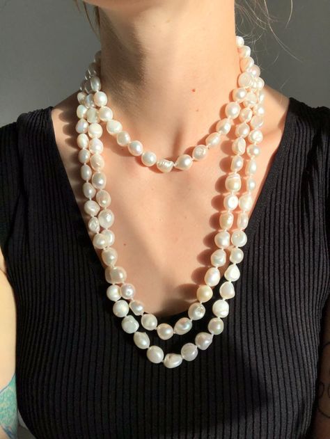 One very long strand of large baroque pearls in a white colour. All pearls are irregular. The strand is roughly 62 inches all around and can be looped around my head 3 times comfortably. This would be great as a necklace or you could repurpose in other crafts. Priced well compared to other pearls of a similar length and size. I do not know how old these are but they're likely more modern and were purchased second hand. 62 inches around  Pearls are roughly 1cm by 1cm Will be mailed with tracking Long Pearl Necklace, Long Pearl Necklaces, Pearl Strand, Real Pearls, How Old, Pearl Strands, White Colour, Baroque Pearls, Repurpose