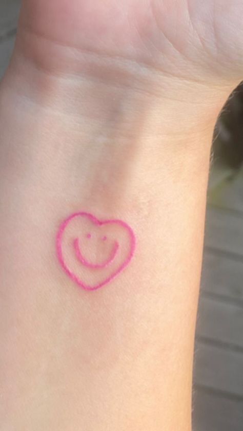 tattoo uploaded by tatiana on We Heart It Smiley Heart Tattoo, Cute Pink Tattoos, Eeaao Tattoos, Cute Heart Tattoos, Pink Heart Tattoo, Pink Ink Tattoo, Pink Tattoo Ink, Dr Tattoo, Heart Tattoo Ideas