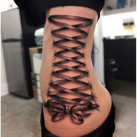 Chronic Ink Tattoo - Toronto Tattoo Ribbon corset tattoo done by Martin. Lace Up Back Tattoo, Back Corset Tattoos For Women, Ribbon Corset Tattoo, Corset Ribbon Tattoo, Corset Tattoo Back, Corset Piercing Tattoo, Corset Tattoo Leg, Traditional Ribbon Tattoo, Corset Tattoos For Women