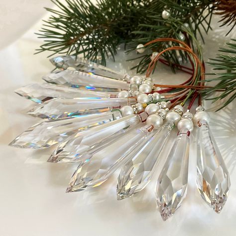 "Glass Prism Christmas Ornaments - Faceted Glass - Clear Glass Crystal - Unique Ornaments - Sparkly Christmas Ornament These wonderful Christmas ornaments feature beautiful glass chandelier prisms! The teardrop prisms are made of 30% lead crystal, are multi faceted, and are about 3\" long. They are incredibly sparkly in the light and pick up all the colors that exist around them! They are topped with white pearls and a glittering crystal rhinestone rondelle and are strung on colorful metallic le Crystal Christmas Ornaments, Glass Prism, Sparkly Christmas, Pink Victorian, Unique Ornaments, Crystal Christmas Tree, Icicle Ornaments, Crystal Christmas, Unique Christmas Ornaments