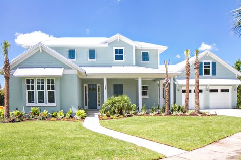 The Sanctuary - Beach Style - Exterior - Jacksonville - by Glenn Layton Homes | Houzz White House Blue Accents Exterior, White Roof House Exterior Colors, Blue Stucco Exterior, Beach Houses Exterior, Coastal House Exterior, Outside House Colors, Coastal Ideas, Metal Roof Houses, Farmhouse Makeover