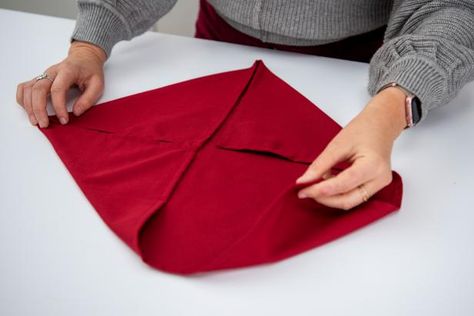 6 Ways to Fold Napkins for Christmas | Holiday Napkin Folding Ideas | HGTV Napkin Folding Ideas Without Ring, Christmas Napkin Folds, Holiday Napkin Folding, Christmas Napkin Folding Tutorials, Christmas Napkin Folding Ideas, Ways To Fold Napkins, Napkins Folding, Christmas Tree Napkin Fold, Christmas Tree Poinsettia