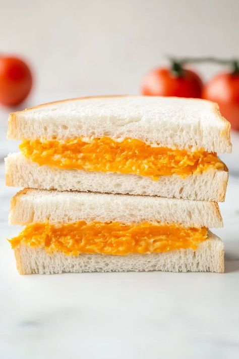 This tomato twiddle is a sandwich you'll make again and again! It's made with ripe tomatoes, cheddar cheese, and onion on white bread. Tomato Twiddle Sandwich, Savory Tea Sandwiches, Tea Party Sandwiches, Summer Sandwiches, Easy Sandwich Recipes, Party Sandwiches, Tea Party Food, Healthy Sandwiches, Low Sodium Recipes