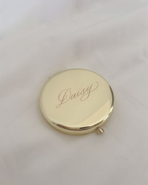 Just added a limited number of these hand-engraved compact mirrors on my website, ready to be personalized with a name! 💖 Available in 4 beautiful colours - gold, rose gold, silver and black. Mina’s already approved (she caught herself in the mirror and is looking pretty adorable) so I’m sure you’ll love them too ✨ Limited time offer. www.rosemay.studio #engravedgifts #handengravedgifts #personalisedgifts #bridesmaidgifts #custommirror #compactmirror Channel Compact Mirror, Personalized Pocket Mirror, Engraved Compact Mirror, Compact Mirror Aesthetic, Personalized Mirror, Personalized Compact Mirror, Daisy Buchanan, Emi Jay, Xmas Wishlist