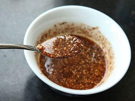 A spicy burnt garli and sesame condiment for drizzling into pork-based ramen. Ramen Broth, Black Garlic, Food Lab, Garlic Oil, Crispy Pork, Ramen Recipes, Braised Pork, Chili Oil, Serious Eats