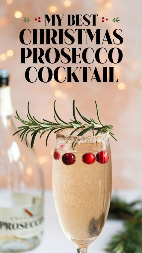 This image features a beautifully garnished **Christmas Prosecco Cocktail**, with floating cranberries, a sugared rim, and a fresh sprig of rosemary. Paired with soft festive lights and a Prosecco bottle in the background, it’s the perfect drink for holiday cheer and elegance. Pajamas And Prosecco Christmas Party, Prosecco Drink Recipes, Spicy Christmas Cocktail, Christmas Sparkling Cocktails, Champagne Based Cocktails, Christmas Cocktail Prosecco, Christmas Drinks With Champagne, Christmas Prosecco Drinks, Champagne Christmas Cocktail