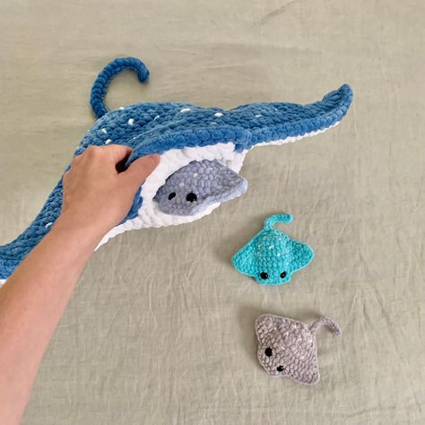 ***PLEASE NOTE: THIS PURCHASE IS ONLY FOR DIGITAL CROCHET PATTERNS, NOT THE FINISHED ANIMALS. AVAILABLE IN ENGLISH ONLY*** Create your own mega stingray with a pocket* to store 4 mini rays! This pattern set includes BOTH the mega ray and the mini ray PDF patterns. *You can choose if you want to make this mega ray with a pocket (or mouth insert), to store mini rays or without a pocket. The ray with a pocket requires very minimal sewing. The ray without a pocket requires no sewing. The mini ray is How To Crochet A Stingray, Pocket Animals Crochet, Squishy Crochet Animals, Crochet Skunk Pattern, Free Fluffy Crochet Patterns, Baby Stuffed Animals Crochet, Crochet Manatee Pattern Free, Crochet Stuffed Animals Patterns, Free Otter Crochet Pattern