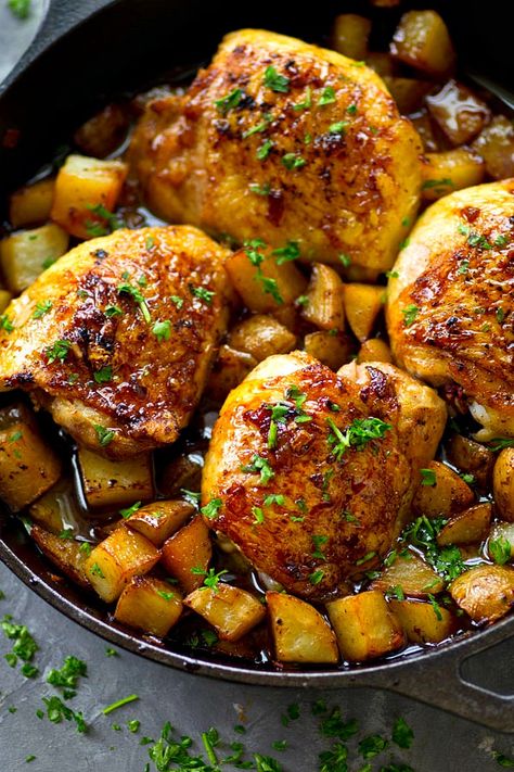 Juicy honey garlic chicken thighs and crispy roast potatoes are seared and baked in the most FLAVORFUL honey garlic sauce in this no-fuss one skillet dinner! Chicken Thighs And Potatoes, Skillet Chicken Thighs, Entertainment Recipes, Garlic Chicken Thighs, Honey Garlic Chicken Thighs, Health Meals, Farm Recipes, Crispy Roast Potatoes, Chicken Breast Crockpot Recipes