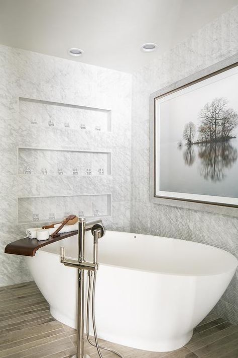 A catty-corner oval bathtub displaying a teak bath shelf tray along with a polished nickel free standing tub faucet/shower head. Niche In Wall, Bath Tub Tray, Corner Soaking Tub, Diy Tile Shower, Bathtub Shelf, Teak Bath, Bathroom Niche, Tub Design, Standing Tub