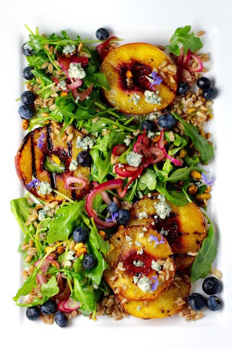 Grilled Peach Salad Bourbon Grilled Peaches, Arugula, Farro Blueberries, Red Onion, Bleu Cheese, Pistachio Nuts Maple Bourbon Rosemary Dressing The kinship between peaches and bourbon is the foundation for this wildly flavorful summer salad. The natural flavor attractions and diverse tastes and mouthfeel of pickled red onion, bleu cheese, and pistachio nuts pull it all … Continue reading "Grilled Peach Salad, Maple Bourbon Dressing" Rosemary Dressing, Salad Arugula, Farro Recipes, Grilled Peach Salad, Maple Bourbon, Resep Salad, Peach Salad, Bleu Cheese, Grilled Peaches