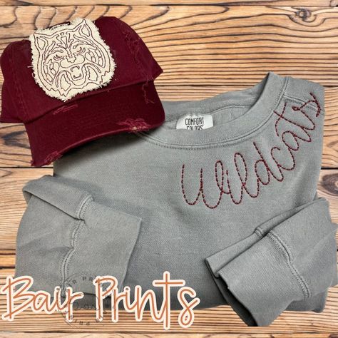 This Embroidered Mascot Sweatshirt will have you bellowing 'hooray'! Show your spirit and rep your school or team like there's no tomorrow. Show up to the game looking sharp with this lightweight, yet cozy sweatshirt. Work it, rock it, and go! This sweatshirt is made with embroidery on a super comfy Comfort Color sweatshirt. Please see the pictures for a color and size chart. Your item will be made in our shop and ship directly to you from Oak Ridge, Tennessee.  Please see the top banner for processing times.  This top does have handdistressing along the collar and cuffs. If you would like to leave this option off please make sure you put that in the customization box.  How to Order: In the customization box below leave your school mascot name and thread choice. School Spirit Shirts Embroidered, Hand Embroidery College Sweatshirt, Trending Embroidered Sweatshirts, School Spirit Crewneck, Hand Embroidery Shirts For Women, Spirit Sweatshirt Ideas, High School Sweatshirts Designs, Embroidered School Sweatshirt, Diy School Spirit Shirts