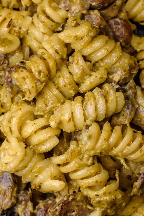 Delicious fusilli pasta with green pesto sauce, with salt and spices stock photos Pesto Food Photography, Pasta Pesto Photography, Chicken Pesto Pine Nut Pasta, Noodles And Company Pesto Cavatappi, Pesto Pasta Aesthetic Instagram, Vector Nature, Concrete Background, Fusilli Pasta, Green Pesto