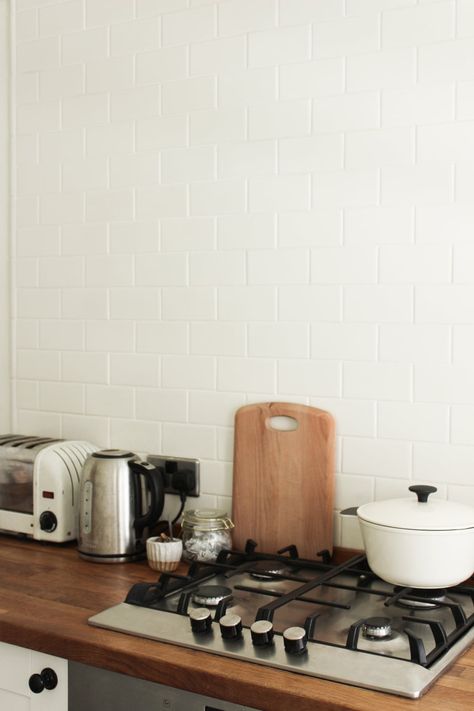 This kitchen is my favourite room in the whole house! With wooden counter tops, a floor-to-ceiling pantry, and a gas stove, my inner chef is SO happy here! For the kitchen, we brought our Prestige Eco Pots & Pans, as well as our vintage Dualit toaster we found on the roadside while living in London. Joining that has been our kettle – another item found on the street! – as well as an entire crockery set gifted to us by family. Finishing touches have... Wooden Counter Tops, 19th Century Cottage, Dualit Toaster, Crockery Set, Living In London, Wooden Counter, Pots Pans, Our New Home, Counter Tops