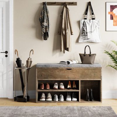 Keep your shoes organized and your entryway or living room clutter-free with this shoes storage bench. The bench features two tiers of open shelves, providing ample storage space for 2-3 pairs of shoes. The comfortable cushion provides a cozy spot for putting on and taking off shoes, and the small notch on the front of the cushion makes it easy to open and access your shoes. This shoe rack bench is not only practical but also versatile, suitable for multiple usages as a seating area or a decorat Shoe Rack Bench, Shoe Storage Bench, Shoe Rack Organization, How To Store Shoes, Storage Stool, Brown Furniture, Shoe Shelf, Shoe Bench, Bench With Shoe Storage