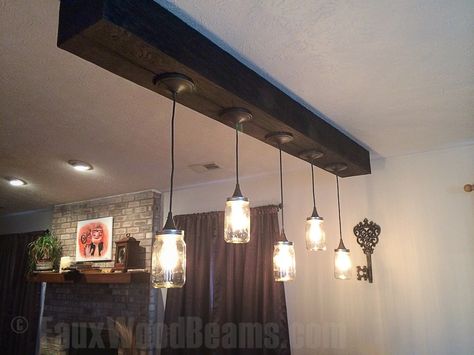 false wood beam with light fixture | ... -style bell jar lights hung from a heavy sandblasted ceiling beam Renovate Cabin, Rustic Bathroom Light Fixtures, Rustic Bathroom Lighting, Diy Industrial Lighting, Industrial Hanging Lights, Rustic Ceiling Lights, Diy Luminaire, Diy Kitchen Backsplash, False Ceiling Living Room