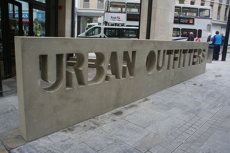 Concrete signage outside Urban Outfitters  would be cool to do something like this on a patio.. with a phase like real good food or something Concrete Signage, Monument Signage, Environmental Graphics Signage, Entrance Signage, Hotel Signage, Office Signage, Signage Signs, Monument Signs, Retail Signage