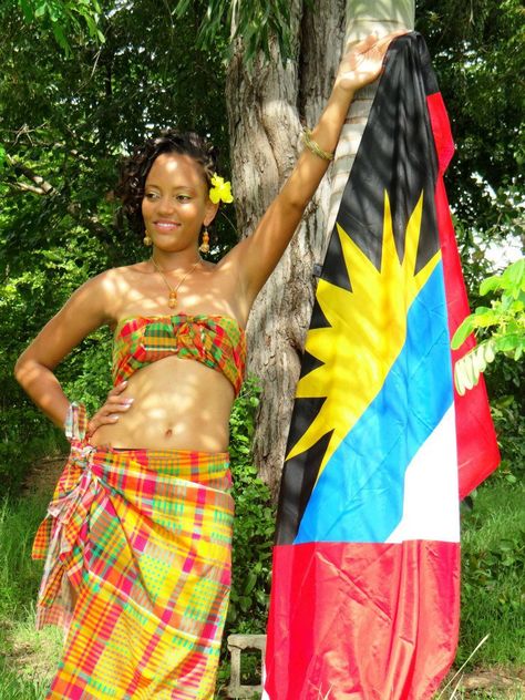 Antigua and Barbuda. This splendid fabric which adorns our locals is called the "Madras" and the bright, yellow sun on our beautiful flag represents the "Dawn of a New Era". Model: Alie Alie Jamaican Cultural Outfits, Trinidad And Tobago Traditional Clothing, Barbados Traditional Clothing, Jamaica Culture Clothes, Pretty Countries, Antigua Flag, Trinidad And Tobago Culture, Caribbean Flags, Island Gyal