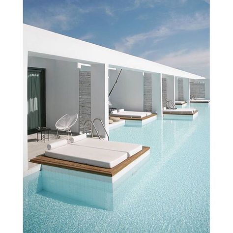 CASA COOK RHODES, Greece. This brand new bohemian boutique hotel is set near the sparkling Aegean Sea  and every room opens out onto this stunning swim-up pool!  Photo Credit: @chaiwalla | Casa Cook Hotel, Moderne Pools, Casa Cook, Beach Furniture, Modern Pools, Dream Pools, Hotel Pool, Swimming Pool Designs, Outdoor Swimming