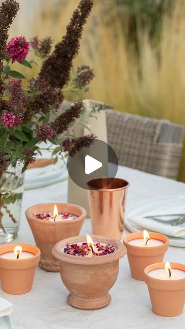 Sugar & Charm / Eden Passante on Instagram: "Create your own charming and affordable candles for gatherings with this easy DIY using mini terracotta pots, soy wax, wicks, pennies, and sticks 🕯️

These look beautiful for a fall outdoor gathering and are very easy to make. 

BOOKMARK and SAVE this posts next time you’re hosting a gathering! You will love watching the glow of these cute handmade terracotta candles.

DIY Terracotta Candles
2 lb soy wax
wicks (small)
pennies
small twigs
mini terracotta planters 
essential oils or scents of your choice 
glue 
scissors 
double boiler or microwave-safe container for melting wax 
heat-resistant measuring cup 
stirring utensil

Directions
Glue a penny to the bottom of the terracotta pot to secure the hole.
Follow the steps for melting candle wax on Terracotta Diy Ideas, Melting Candle Wax, Mini Terracotta Pots, Hygge Crafts, Terracotta Candle, Soiree Ideas, Melting Candle, Handmade Candles Diy, Tomato Vine