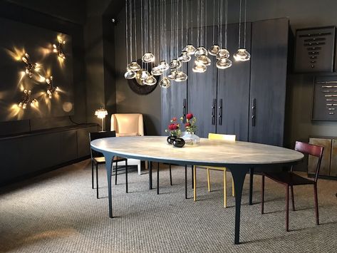 OCHRE's New York showroom at the D&D Building Ochre Lighting, Mountain Home, Chandelier In Living Room, Mountain House, Lighting Design, Showroom, Natural Beauty, Conference Room Table, Lamps