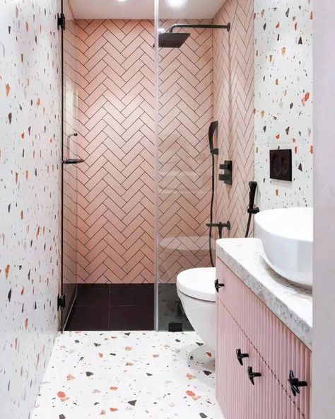 The Terrazzo tiles with large white negative space give the illusion that this bathroom is bigger than it is. Image credit: INSTAGRAM @DESIGNERWORK92 Bathroom With Terrazzo, Dusty Pink Bathroom, Pink Terrazzo Bathroom, Terrazzo Tiles Bathroom, Terrazzo Bathroom Design, Herringbone Tile Bathroom, Toilet Designs, Small Bathroom Styles, Tile Bathroom Ideas