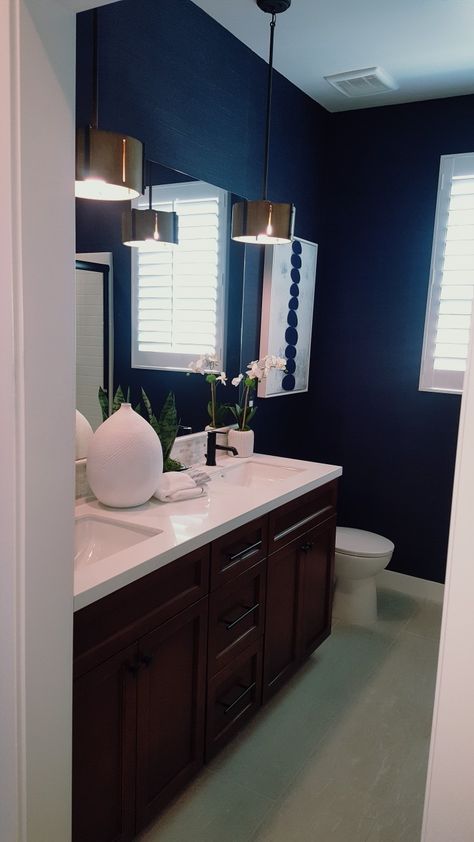 Navy blue bathroom walls Navy Blue Wall Bathroom, Midnight Blue Bathroom Walls, Navy Blue Restroom, Navy Blue Board And Batten Wall Bathroom, Midnight Blue Bathroom, Blue Bathroom With Dark Brown Vanity, Dark Blue Bathroom Walls, Bathroom Decor Dark Blue, Navy Bathroom Walls