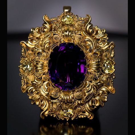 Antique Amethyst Chrysolite Gold Brooch Pendant Circa 1830. This antique convertible brooch / pendant features an excellent amethyst of a royal purple color. The amethyst is set in ornate filigree gold bezel accented by four golden green chrysolites. The amethyst is approximately 19.43 carats. Antique Amethyst Jewelry, Royal Purple Color, Modern Jewellery Design, Amethyst Set, Golden Green, Gold Beauty, Gold Rings Fashion, Purple Jewelry, Gold Brooch