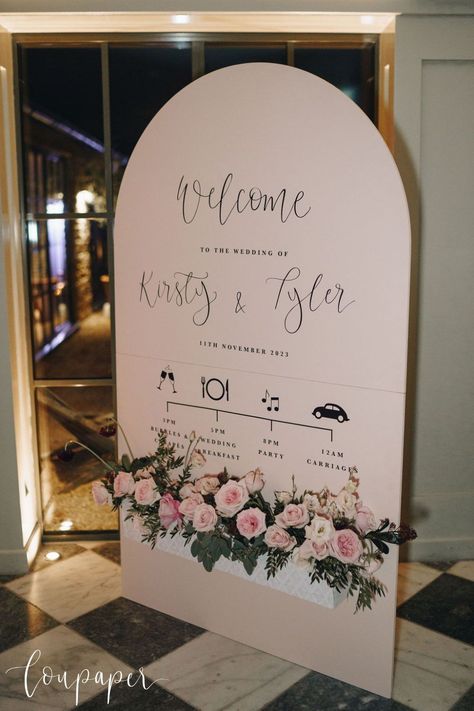 A pale pink curved wedding welcome and order of events sign, accessorised with pretty blooms for this stylish winter wedding. Get inspired by this beautiful wedding day on the LouPaper blog. Photo credit: Winnington and Coe. Order Of Events Sign, Calligraphy Wedding Stationery, Wedding Venue Illustration, Calligraphy A, Pink Duck, Venue Illustration, Order Of Events, Bespoke Wedding Stationery, Gold Calligraphy