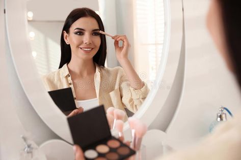 Beautiful young woman applying makeup near mirror. Indoors #Sponsored , #Ad, #woman, #applying, #Beautiful, #young, #Indoors Doing Makeup In Mirror, Girl Doing Makeup, Makeup In Mirror, Someone Doing Makeup In Mirror, Mirror Reference, Woman Looking In Mirror Photography, Applying Lipstick In Mirror, Woman Doing Makeup In Mirror, Woman Applying Makeup