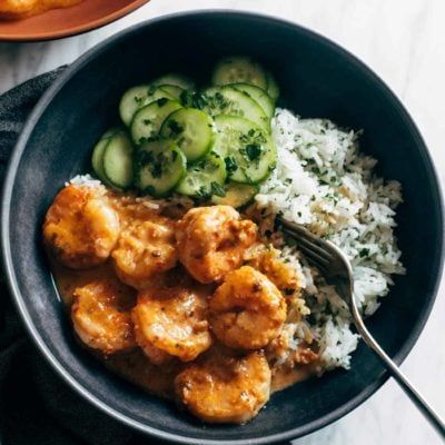 Chipotle Orange Shrimp with Cilantro Rice! Tender shrimp in a sweet-meets-smoky cream sauce piled high on cilantro-speckled rice with a side of tangy cucumbers. #shrimp #rice #easyrecipe Cilantro Rice Recipe, Bbq Baked Potatoes, Orange Shrimp, Parmesan Orzo, Cucumber Sauce, Creamed Cucumbers, Cilantro Rice, Pinch Of Yum, Juicy Shrimp