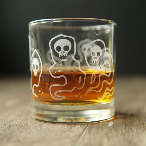 Our Wraith lowball glass is a hauntingly beautiful piece of glassware. Its ghostly design features apparitions of floating skulls cloaked in wispy vapor. Perfect for adding a spooky touch to your Halloween or goth decor. Embrace the otherworldly mystery of this paranormal cocktail glass. Custom Gift Cards, Spooky Halloween Decorations, Goth Decor, Hauntingly Beautiful, Cocktail Glass, Halloween Ghost, Recycled Glass, Halloween Design, Practical Gifts