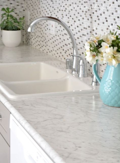 formica marble look countertops (Formica carrara bianco 6696) replaced my counters with this in my kitchen update, really happy with how they look!