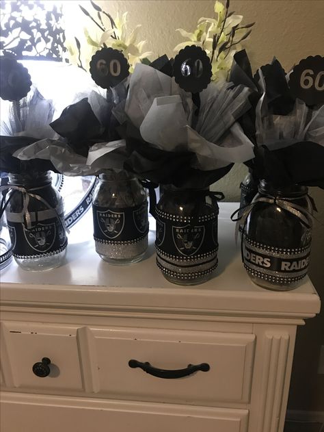 Raider center pieces Raider Centerpieces Party Ideas, Raiders Centerpieces, Raiders Party Ideas, Raider Party Decorations Ideas, Raider Themed Birthday Party, Raiders Theme Party Ideas, Raiders Party Decorations, Cheer Centerpieces, Centerpieces For Party For Men