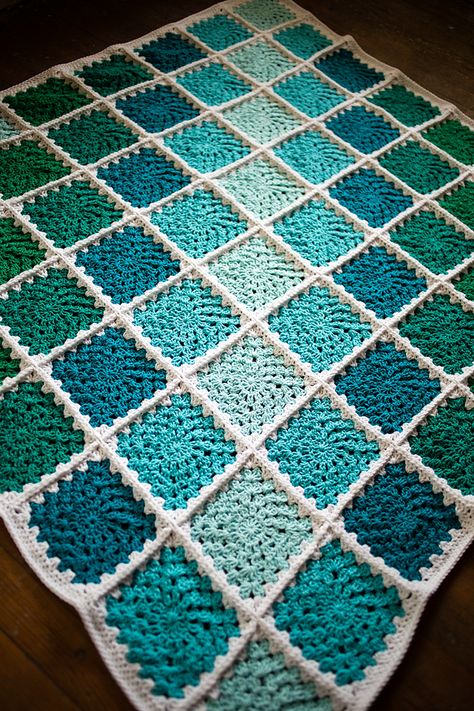 Granny square blanket! Made with 'I Love This Cotton' from Hobby Lobby; 5.5mm hook. Sunburst Granny pattern. #crochet #afghan #crochetafghan #crochetblanket Turquoise Granny Square Blanket, Teal Granny Square Blanket, Ombre Granny Square Blanket, Ocean Granny Square, Beach Blanket Crochet, Blue Crochet Blanket, Crochet Hat Sizing, Granny Pattern, Granny Square Crochet Patterns Free