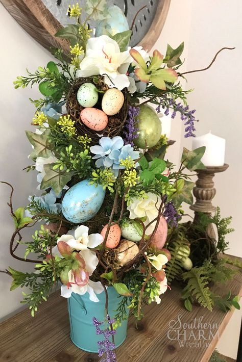 In this DIY, learn to make an Easter Egg Topiary Tree like the pros using silk flowers, plastic eggs and greenery by Southern Charm Wreaths. #easter #topiary #easterdecor #diy #howto #eastertree Easter Topiary Tree, Easter Egg Tree Diy, Easter Egg Topiary, Egg Topiary, Easter Tree Diy, Easter Topiary, Diy Tree Decor, Making Easter Eggs, Easter Tree Ornaments