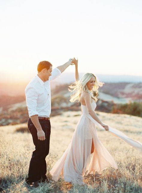 Spinning Dress Photography, Twirl Engagement Photo, Flowy Dress For Engagement Pictures, Twirling Engagement Photos, Engagement Photos Flowy Dress, Spinning Engagement Photo, Engagement Photos With Black Dress, Couple Twirling Photo, Couples Spinning Photo