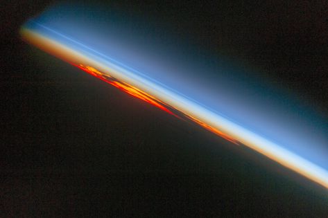 Fiery South Atlantic Sunset: An astronaut aboard the International Space Station photographed a sunset that looks like a vast sheet of flame. With Earths surface already in darkness the setting sun the cloud masses and the sideways viewing angle make a powerful image of the kind that astronauts use to commemorate their flights. Earth On Fire, Space The Final Frontier, Nasa Pictures, Astronomy Pictures, Nasa Photos, Earth Images, Nasa Images, Nasa Missions, Space Photography