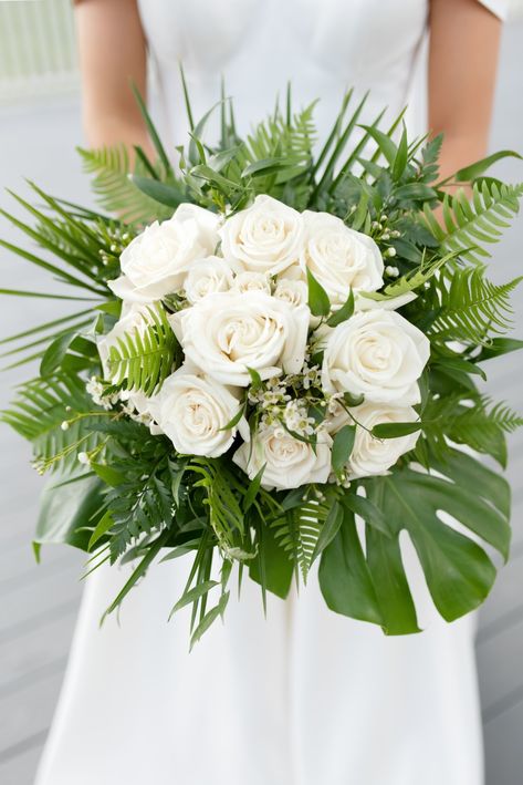 White roses, wax flowers, monstera plant, fern, greenery Wedding Bouquets Palm Leaves, Monstera Wedding Bouquet, Tropical Greenery Bouquet, Monstera Bridal Bouquet, Monstera Wedding Decor, White Tropical Wedding Bouquets, Wedding Monstera Decoration, White Tropical Wedding Flowers, Monstera Bouquet