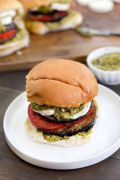 This flavorful Mediterranean Eggplant Burger has the eggplant Parmesan tastes you love, plus delicious pesto as the condiment. #veggieburger #vegetarianburgers #eggplant #eggplantparmesan  via @thecookful Eggplant Burger, Mediterranean Eggplant, Mediterranean Burger, Pan Fried Eggplant, Vegetarian Burger Recipe, Eggplant Sandwich, Small Eggplant, Chicken Burgers Recipe, Eggplant Dishes