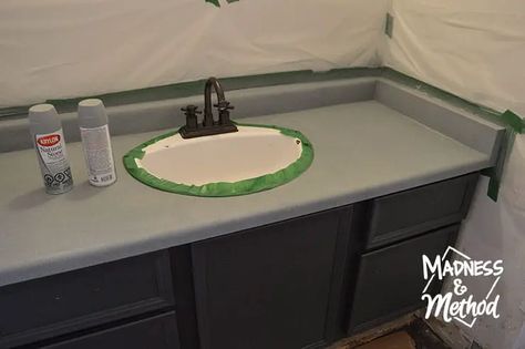 Do you have an ugly and outdated countertop? Spray painting bathroom counters is cheap and easy, and it completely transforms the look! Bathroom Counter Makeover Diy, Bathroom Counter Paint Diy, Resurface Bathroom Countertops, Replace Bathroom Countertop, Diy Bathroom Countertop Makeover, Bathroom Counter Paint, Paint Bathroom Countertop, Bathroom Countertops Redo, Bathroom Vanity Countertop Ideas