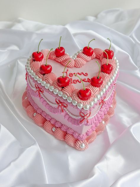 "Handmade item This delightful Heart-shaped fake cake is a treasure made to last. Colour : pale pink, pink, red, coral pink, white pearls, red cherries,  Great for photography, home decorations, props(birthdays, weddings, baby showers, movies, bakery and other shops), display, coffee table styling, shelf styling, gifts and more. Measurement : 8 to 8.5 inch width, 3 to 3.5 inch height. Taller with cherry stems.  Comes without cake board  All our products are handmade with love and care and each product has unique imperfections and we believe it add charms and beauty to the products. Handmade products may feature imperfections such as surface imperfections, tiny cracks, minor irregularities, slight variations in weight, size and colours, tiny marks and dents etc. The product you receive may Fake Cakes For Display, Fake Cake Ideas, Fake Cake Diy, Plaster Cake, Fake Birthday Cake, Cake With Pearls, Styling Shelf, Cake Boxes Diy, Fake Cakes