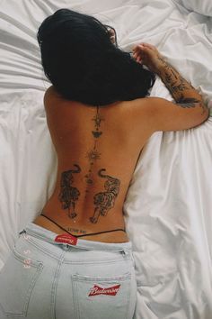 The broken heart stands out as a symbol of profound emotional resonance, representing not just heartbreak, but resilience, healing, and evolution. In this Simplistic Tattoos Back, Multiple Back Tattoos Placement, Spine Tattoos Tiger, Animal Spine Tattoos For Women, Tiger Women Tattoo, Back Tattoo Women Feminine, Back Tattoo Animals, 2 Tiger Tattoo For Women, Symmetrical Back Tattoos For Women