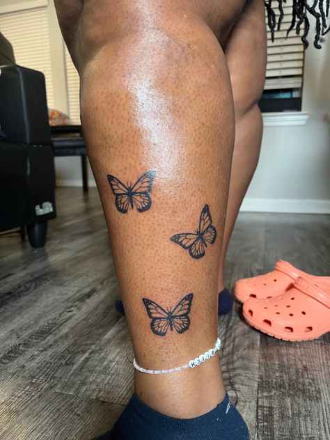 Foot Tattoos Black Women, Leg Tats Women, Thigh Tats For Women Butterfly, Butterfly Leg Tattoo Thighs, Butterfly Flower Leg Tattoo, Butterfly Tattoo Legs Woman, Butterfly Ankle Tattoo Black Women, Women Calves Tattoo, Thigh Tattoos Black Women