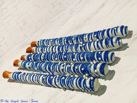 Royal Blue Pretzel Rods, Royal Blue Chocolate Covered Pretzels, Royal Blue Treat Table Ideas, Royal Blue Dessert Table, Blue Treats, Blue Candy Apples, Chocolate Covered Pretzel Sticks, Blue Candy Buffet, Covered Pretzel Rods