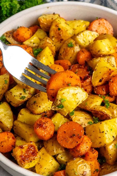 Roasted Potatoes and Carrots Oven Roasted Potatoes Carrots And Onions, Garlic Herb Roasted Potatoes And Carrots, Potatoes Carrots Crockpot, Carrot Potato Recipes, Crockpot Potatoes And Carrots, Potato And Carrot Recipes, Oven Roasted Potatoes And Carrots, Recipe For Roasted Potatoes, Roasted Carrots And Potatoes