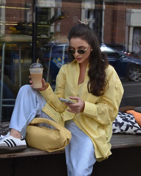 Laid-back vibes in a yellow striped shirt 💛 + light-wash jeans 💙 Thanks to @leramendela for the cozy inspo! ☕️✨ weekend coffee run, casual chic, street style, oversized fit, comfy cool #yellowshirt #casualoutfit #coffeetime #streetwear #laidbackstyle Yellow Shirt Outfit, Popular Clothes, Oversized Shirt Outfit, Yellow Striped Shirt, Oversized Striped Shirt, Top Korean, Striped Shirt Women, Shirt Blouses Women's, Blouse Style