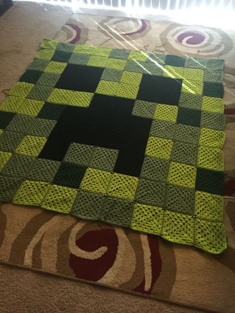 Minecraft creeper granny square crochet blanket. Www.facebook.com/nerdyknits2013 Creeper Crochet Blanket, Minecraft Granny Square Blanket, Crochet Creeper Blanket, Crochet Minecraft Granny Square, Stranger Things Crochet Blanket, Minecraft Crochet Ideas, Minecraft Crochet Blanket, Random Granny Square Blanket, Crochet Creeper