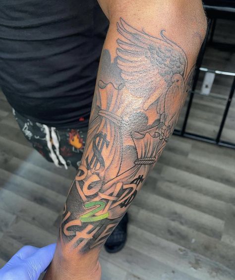 Money Forearm Tattoo Men, Road 2 Riches Tattoo, Forearm Tattoo Men Sleeve Money, Louisiana Tattoo Ideas Men, Hood Forearm Tattoos, Black Man Half Sleeve Tattoo, Atl Tattoo Sleeve, Men’s Upper Arm Sleeve, Arm Sleeve Black Man